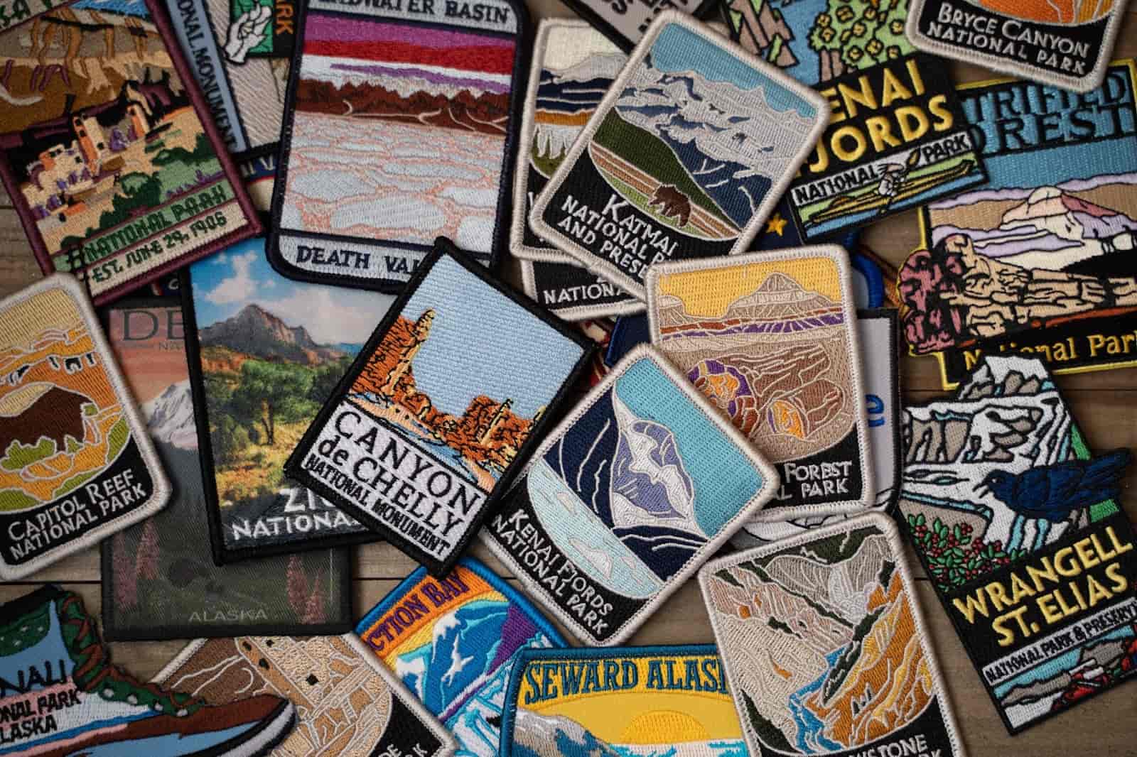 A collection of colorful patches showcasing various locations, perfect for UTV adventure enthusiasts and trail riders.