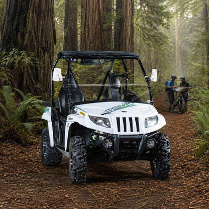 White Arctic Cat Prowler with half windshield on a forest trail among redwood trees