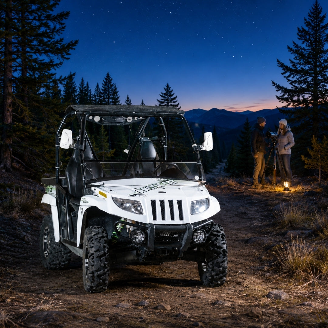 White Arctic Cat Prowler with tilting windshield parked on a trail under a night sky. gallery-1
