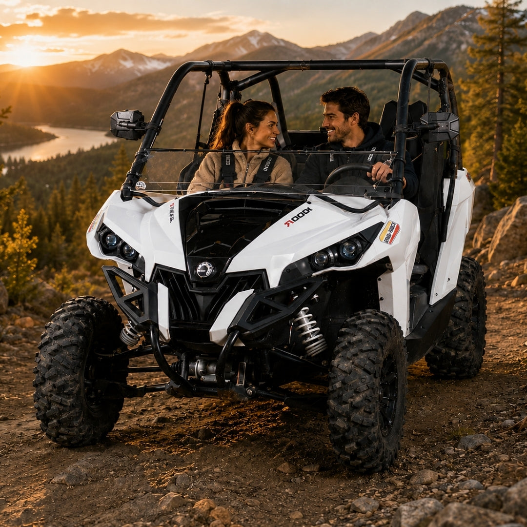 Maverick with tilting windshield climbing a ridge trail at golden hour, driver and passenger aboard