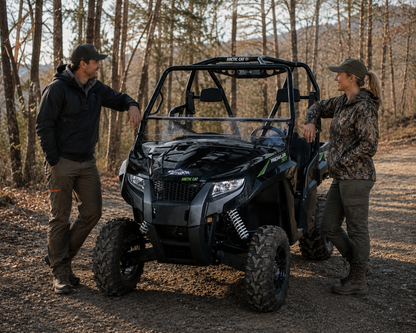 2015-2017 Arctic Cat Prowler with a TerraRider tilting windshieldfor a soft or no top parked outside on a trail