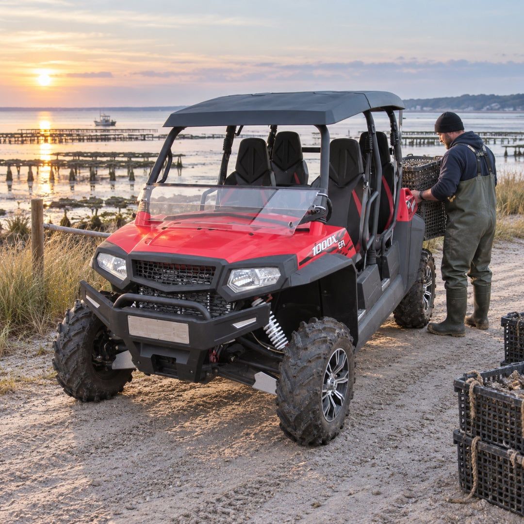 Red four-door Spire 1000 with tilting windshield parked on a lakeside road at sunrise, owner loading gear. gallery-1