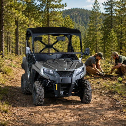 Gray Arctic Cat Prowler 500 with tilting windshield on a forest trail