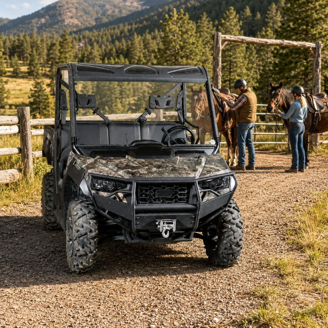 Camo Arctic Cat Prowler Pro with full windshield on a dirt road with people alongside