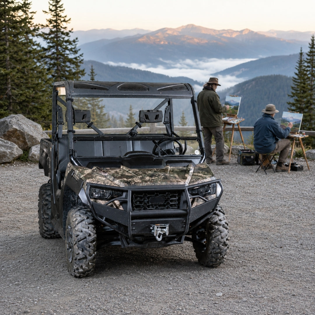 Camo Arctic Cat Prowler Pro with tilting windshield parked on a gravel overlook with people nearby. gallery-1