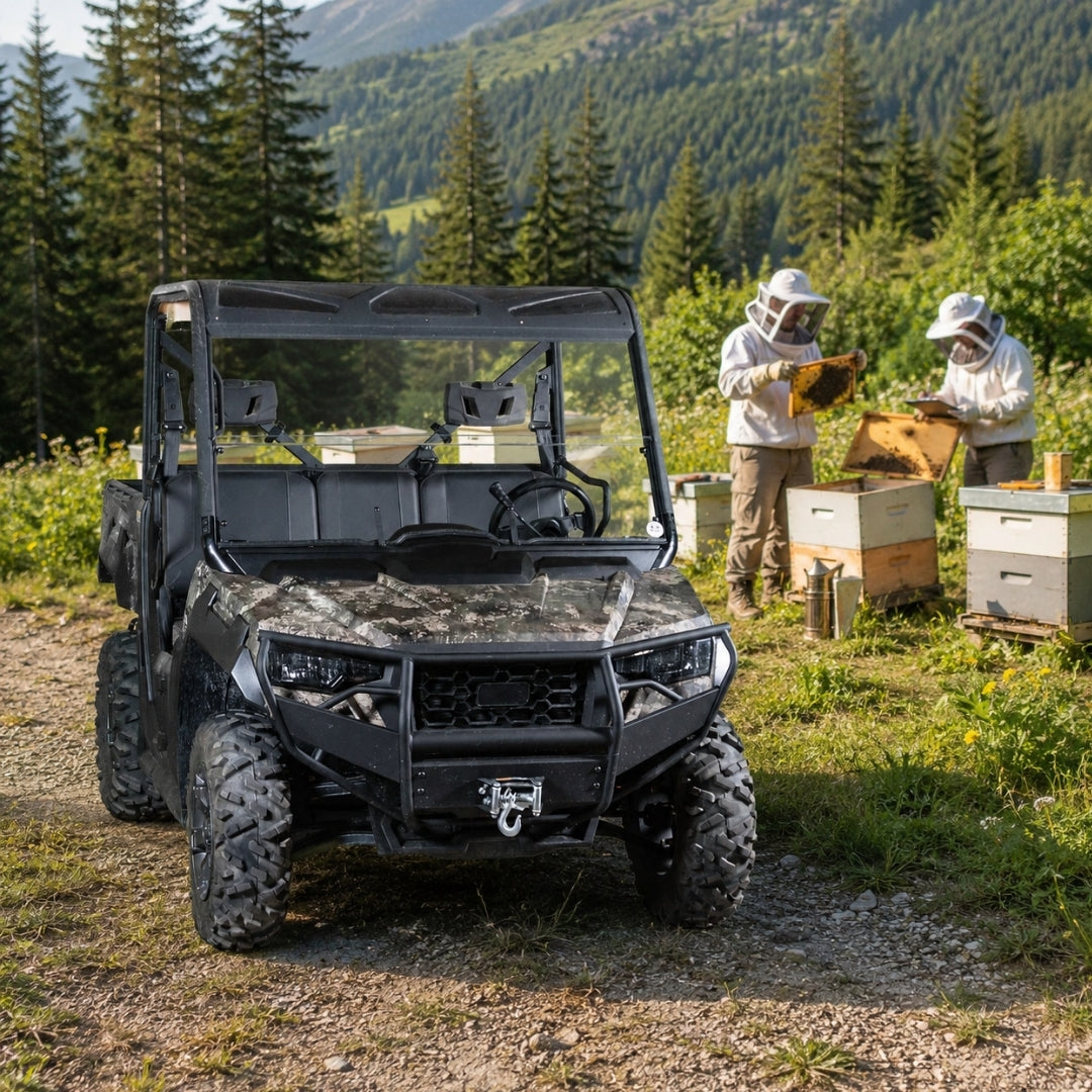 Camo Arctic Cat Prowler Pro with half windshield on a forest trail with a person alongside