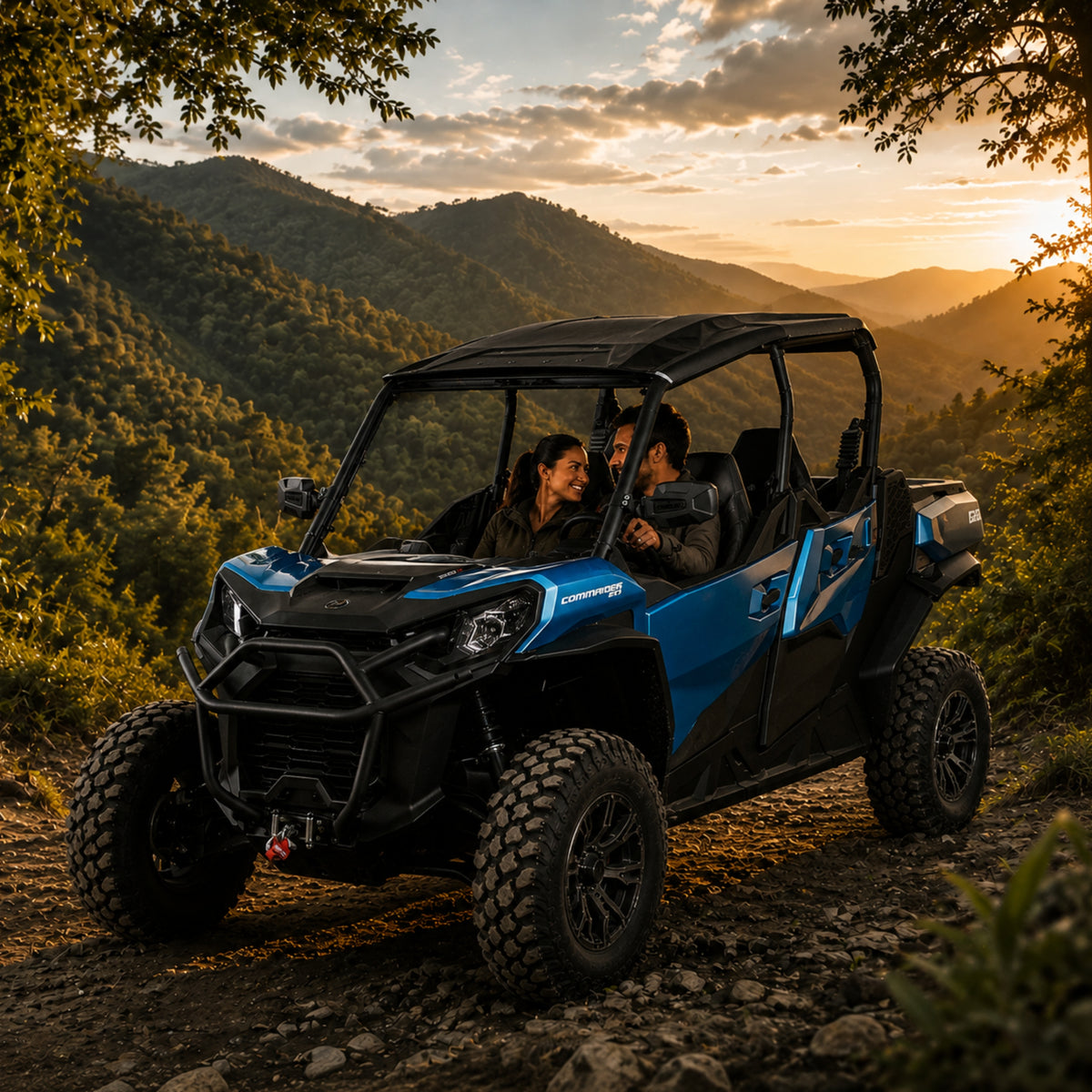 Blue Can-Am Commander with full windshield on a ridge trail at sunset with riders inside