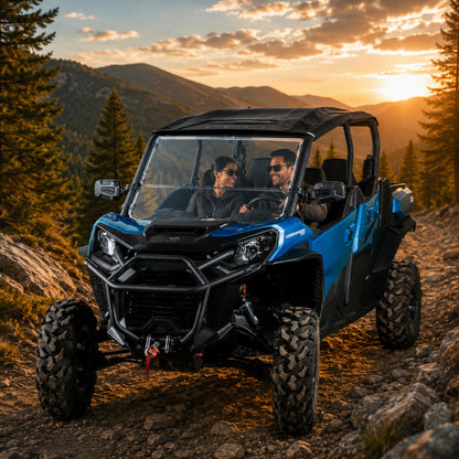 Blue Can-Am Commander with hard top showing a tilting windshield on a ridge at sunset. gallery-1