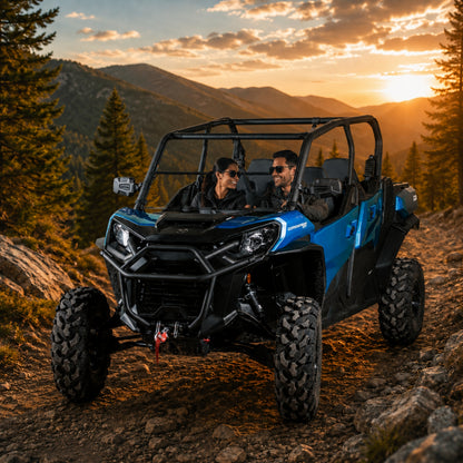 Blue Can-Am Commander with tilting windshield on a ridge at sunset. gallery-2
