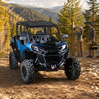 Blue Can-Am Commander with tilting windshield on a mountain trail with fall foliage. gallery-1